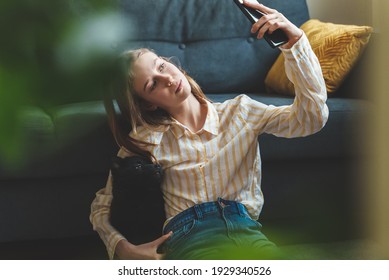 Tween Girl With Puppy Making Selfie.