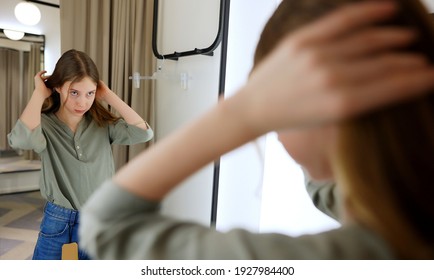 Tween Girl Standing In Fitting Room In Clothing Store.