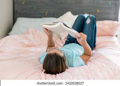 Tween Teen Girl Quietly Reading A Book