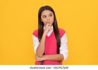 Tween And Youth. Casual Fashion. Thinking Teen Girl On Yellow Background. Childhood Happiness. Back To School. Thoughtful Kid Face Portrait. Dremy Child Has Long Hair. Skin Beauty.