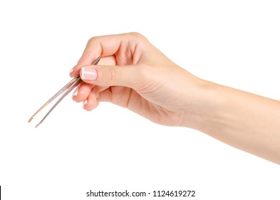 Tweezers for eyebrows in hands on white background isolation