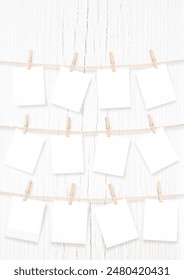 Twelve Blank Rectangle Frames for Baby Pictures Hanging on Rope Isolated. My First Year. Clipping Path for Pictures Included