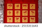 Twelve Chinese zodiac animals displayed on a red background.