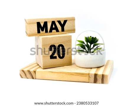 Twentieth may written over wooden blocks 