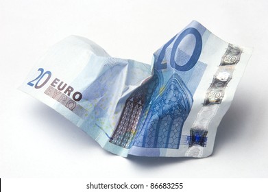Twenty Euro bill crumpled on light background