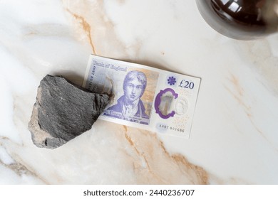 Twenty pound notes on marble table. Finance concept. Сoncept of a stable economy and currency