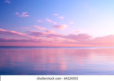 Twilight Dusk. Beautiful clouds over the calm sea.