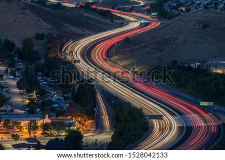 Twilight freeway commuters on route 118 at Yosemite Ave in suburban Simi Valley near Los Angeles, California.