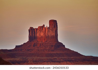 Twilight Glow on Monument Valley Butte, Arizona - Serene Desert Majesty - Powered by Shutterstock