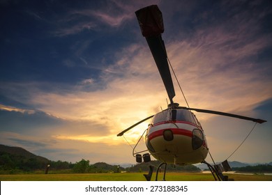 Twilight Helicopter On The Helipad.