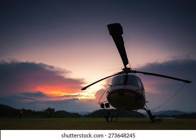 Twilight Helicopter On The Helipad.