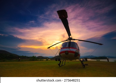 Twilight Helicopter On The Helipad.