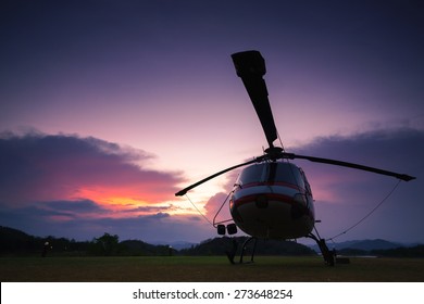 Twilight Helicopter On The Helipad.