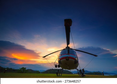 Twilight Helicopter On The Helipad.