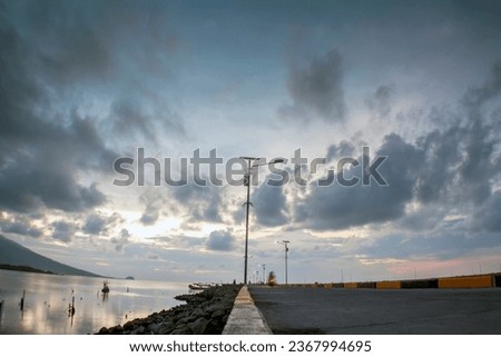 twilight on the pier, the coast at dusk, twilight atmosphere on the pier on the coast