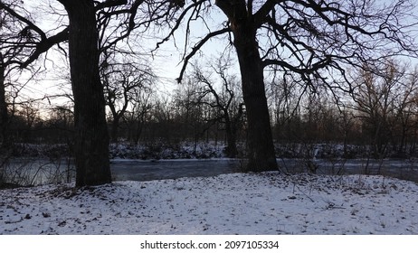 Twilight On The River Bank. Winter Landscape