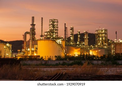 Twilight scene of tank oil refinery plant and tower column of Petrochemistry industry in site construction