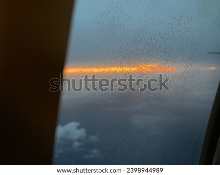 twilight in the sky of Makassar city from a height of 10 thousand feet above the sea in a plane