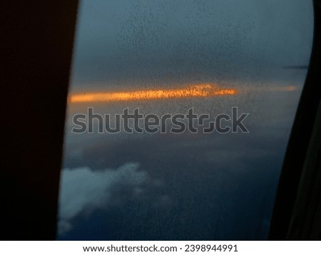 twilight in the sky of Makassar city from a height of 10 thousand feet above the sea in a plane