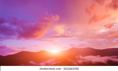 Twilight sky in purple over the mountain - Powered by Shutterstock