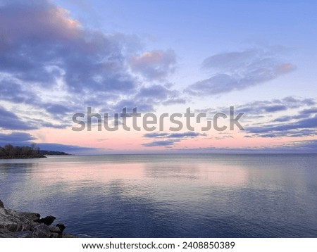 Twilight sky, reflection colour on the water, Lake Ontario, Canada, Beautiful evening.