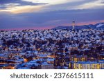 Twilight in the snowy Trondheim, aerial view of the residential districts and TV tower