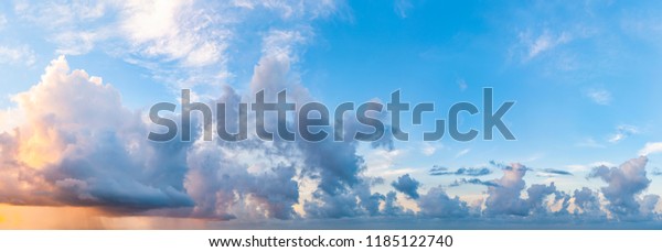 Twilight sunset\
with colorful clouds. Dramatic atmosphere created by the sunlight.\
Colorful gradient from blue to orange. Blue sky and clouds. High\
resolution panoramic\
sky.