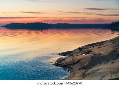 Twilight Sunset View Of The Scandinavian Baltic Sea And Swedish Archipelago With Rocks In The Foreground. Shot During Mid Summer Festival