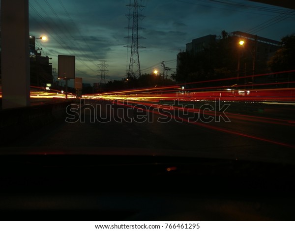 Twilight and tail light trails,\
sunset with the tail light trails paint,light\
painting.