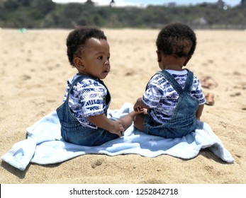 Twin Babies At The Beach