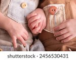 Twin babies Little newborn human baby hands holding each other