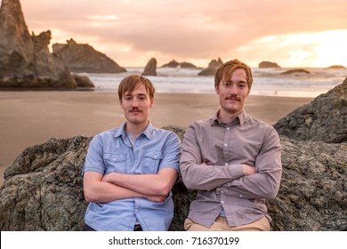 Twin brothers posing at the gorgeous Facerock beach in Bandon, Oregon