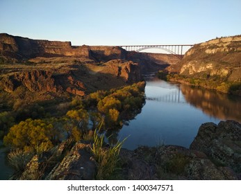 Twin Falls in Idaho. The falls are not on the picture, instead I climped up the hill to have overview above the Snake river and the beautiful bridge. - Shutterstock ID 1400347571