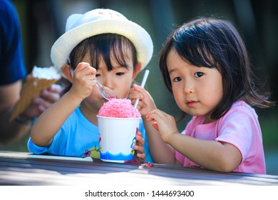 Twin Girls Eating Shaved Ice