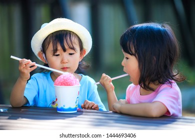 Twin Girls Eating Shaved Ice