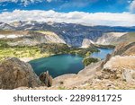 Twin Lakes at the top of the Beartooth Mountain wilderness with blue cloudy sky on the Wyoming and Montana border.