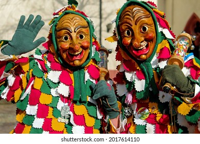 twin masks in festive clothes