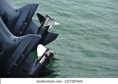 Twin Outboard Motor Boat Propellors In The Water