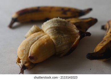 Twin Ripe Plantain Yellow In Colour, Ready To Eat With Skin Half Peeled. Twin Ethakka Or Plantain Is Rarely Seen. Shot On White Background