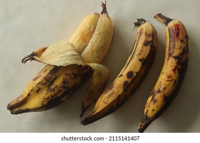 Twin Ripe Plantain Yellow In Colour, Ready To Eat With Skin Half Peeled. Twin Ethakka Or Plantain Is Rarely Seen. Shot On White Background