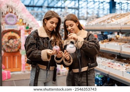 Similar – Image, Stock Photo Twins dressed in Christmas outfits in a festive kitchen