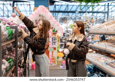 Similar – Image, Stock Photo Twins dressed in Christmas outfits in a festive kitchen