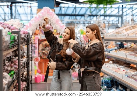 Similar – Image, Stock Photo Twins dressed in Christmas outfits in a festive kitchen