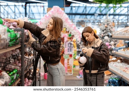 Similar – Image, Stock Photo Twins dressed in Christmas outfits in a festive kitchen