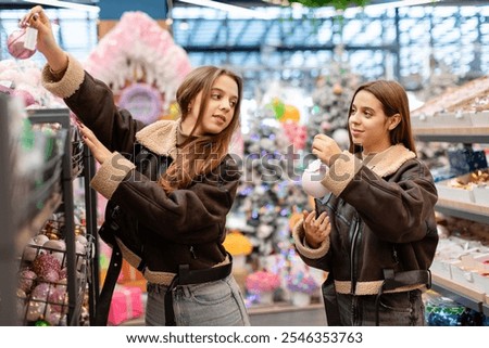 Similar – Image, Stock Photo Twins dressed in Christmas outfits in a festive kitchen