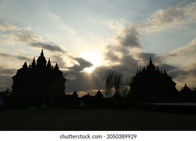 The twin temples of Candi Plaosan in Yogyakarta in silhouette of an evening sky