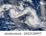Twin Tropical Cyclones. Two storms in the Indian Ocean churned quite close to each other, but not close enough to tango. Elements of this image furnished by NASA.