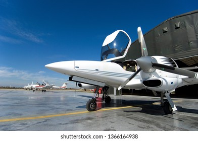 Twin-engine General Aviation Aircraft In Front Of The Hangar In The Airport