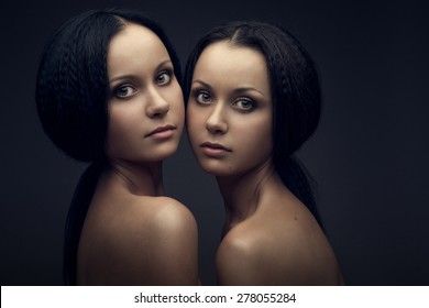 Twins Portrait Isolated On Black Background