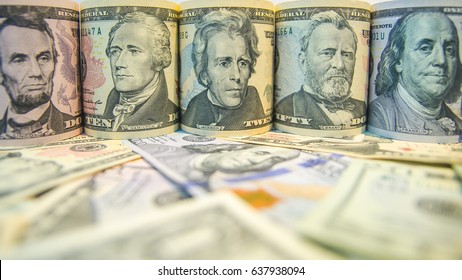 Twisted different US dollar banknotes and put on abstract dollar bills of different denominations note. Dollar bills of different denominations background, Dollars assorted bills, Cash pile background